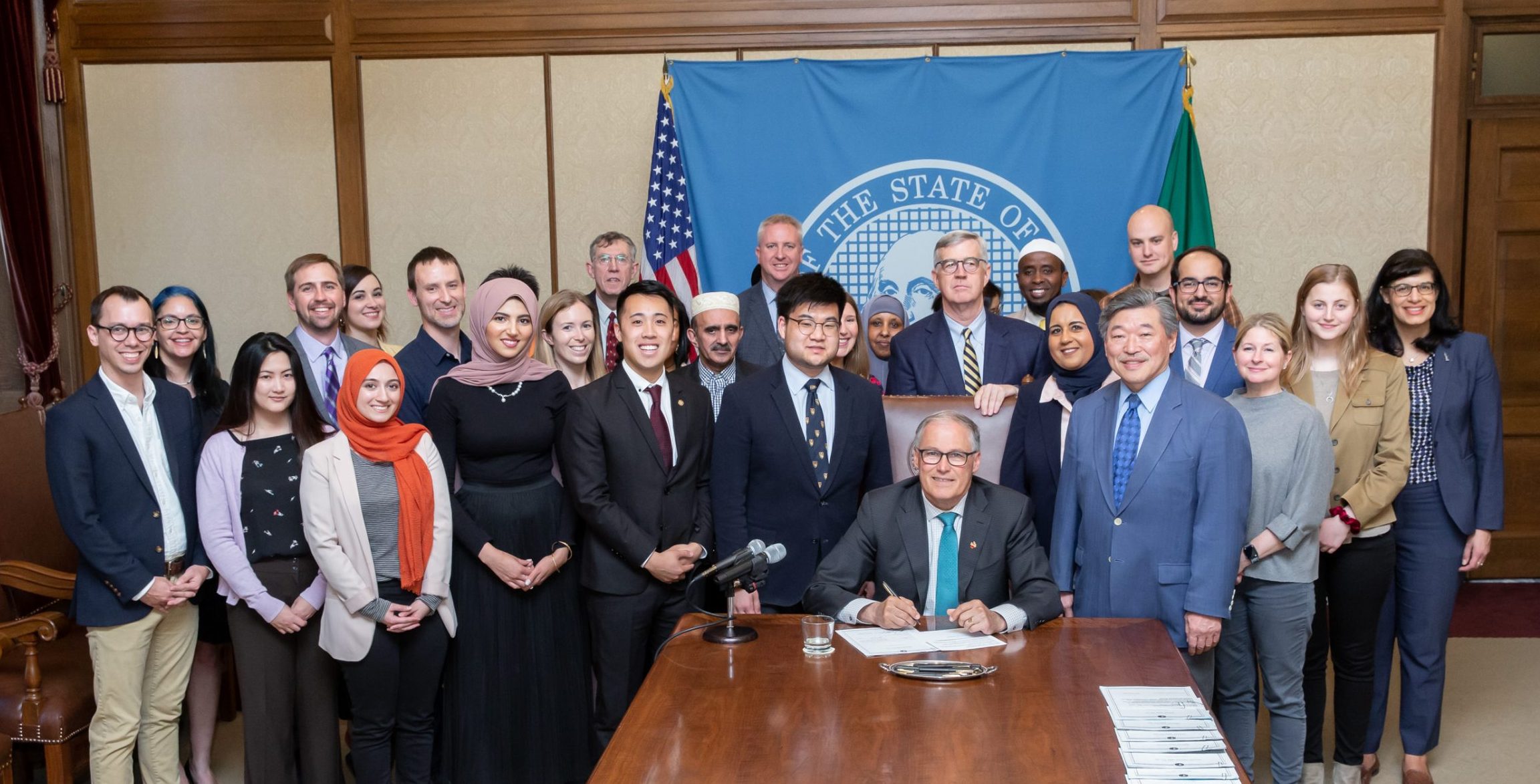 Group at Gov. Jay Inslee's signing of bill 5166