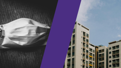 A mask and a large apartment complex