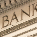 Carved bank sign on building