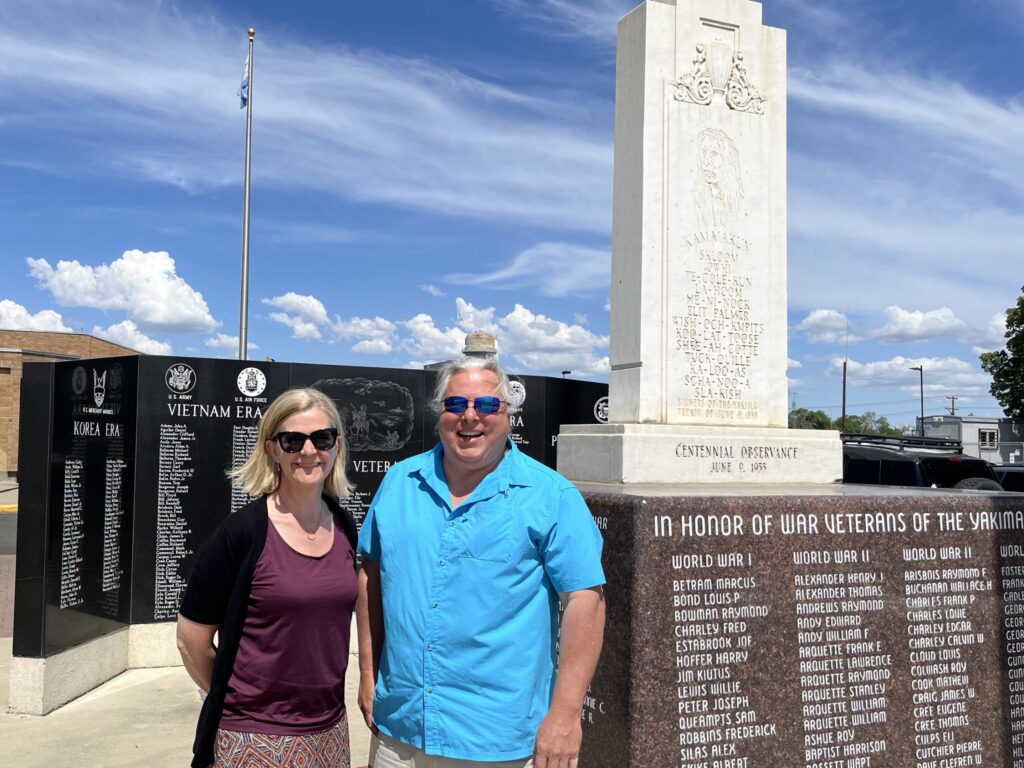 Dean Jodi Sandfort and Deans Council Member pose in front of Yakima War Veteran's monument