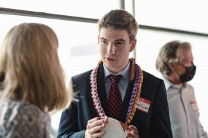 Nathan Loutsis speaks with Evans School Dean Jodi Sandfort at the 2022 NextGen Launch event.
