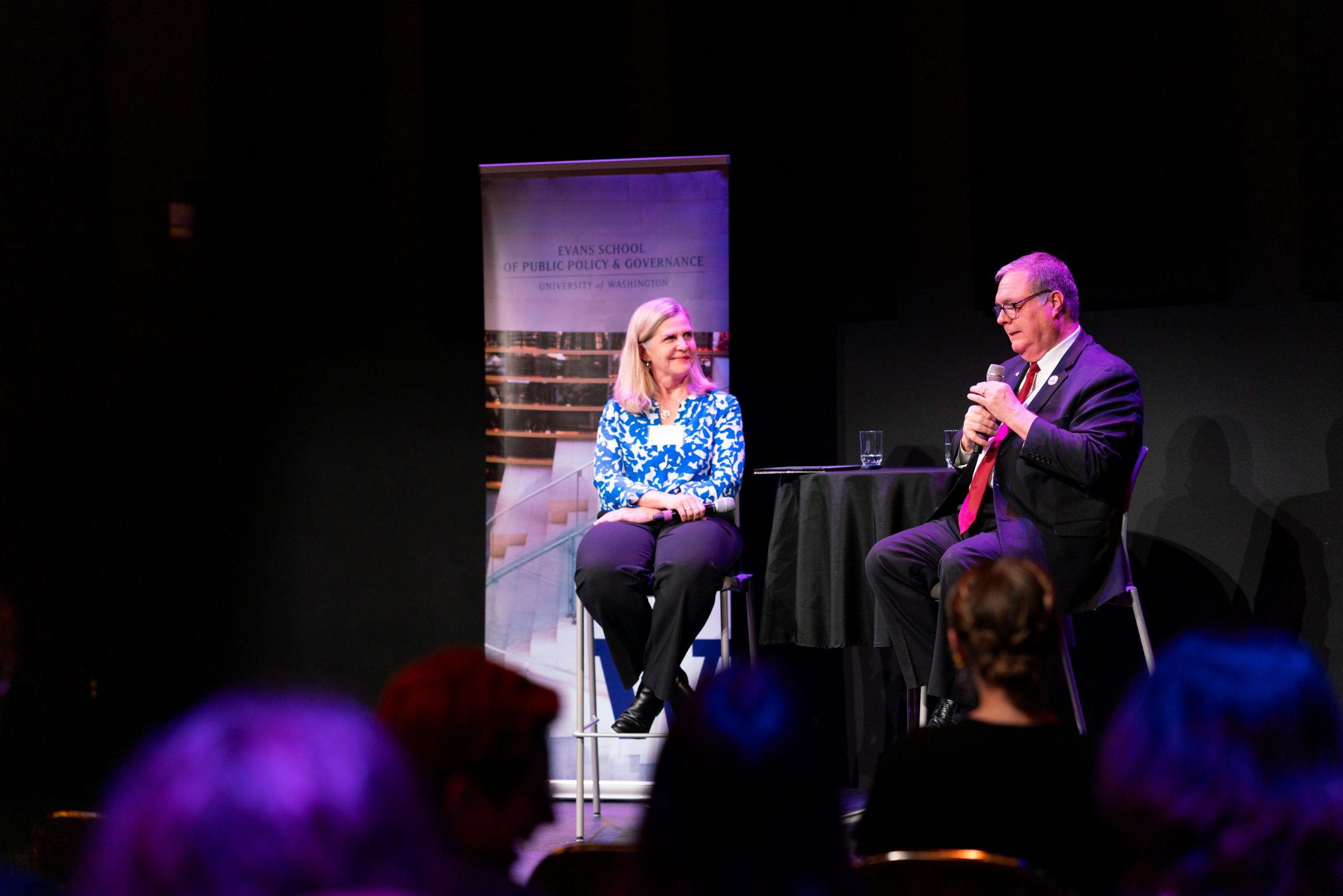 Dean Jodi Sandfort and Lt. Governor Denny Heck lead conversation from stage
