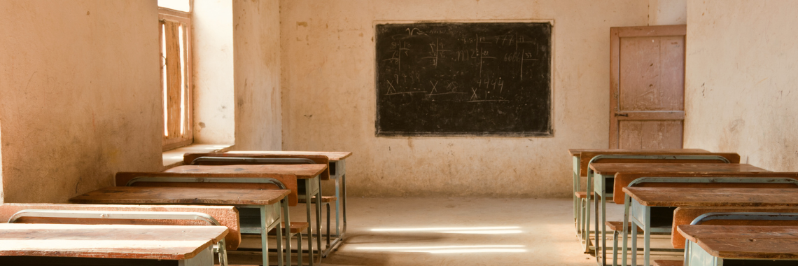 Empty Classroom An empty classroom with wooden desks and a blackboard